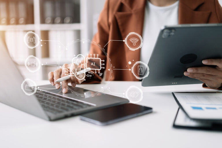 AI or Artificial Intelligence technology. Businessman using a smartphone and laptop computer chatting with an intelligent artificial intelligence. Futuristic technology, automate Chat Bot, Smart Ai