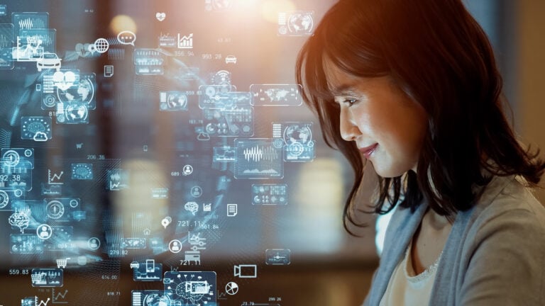 Asian woman watching hologram screens. Business and technology concept. Smart office. GUI (Graphical User Interface)